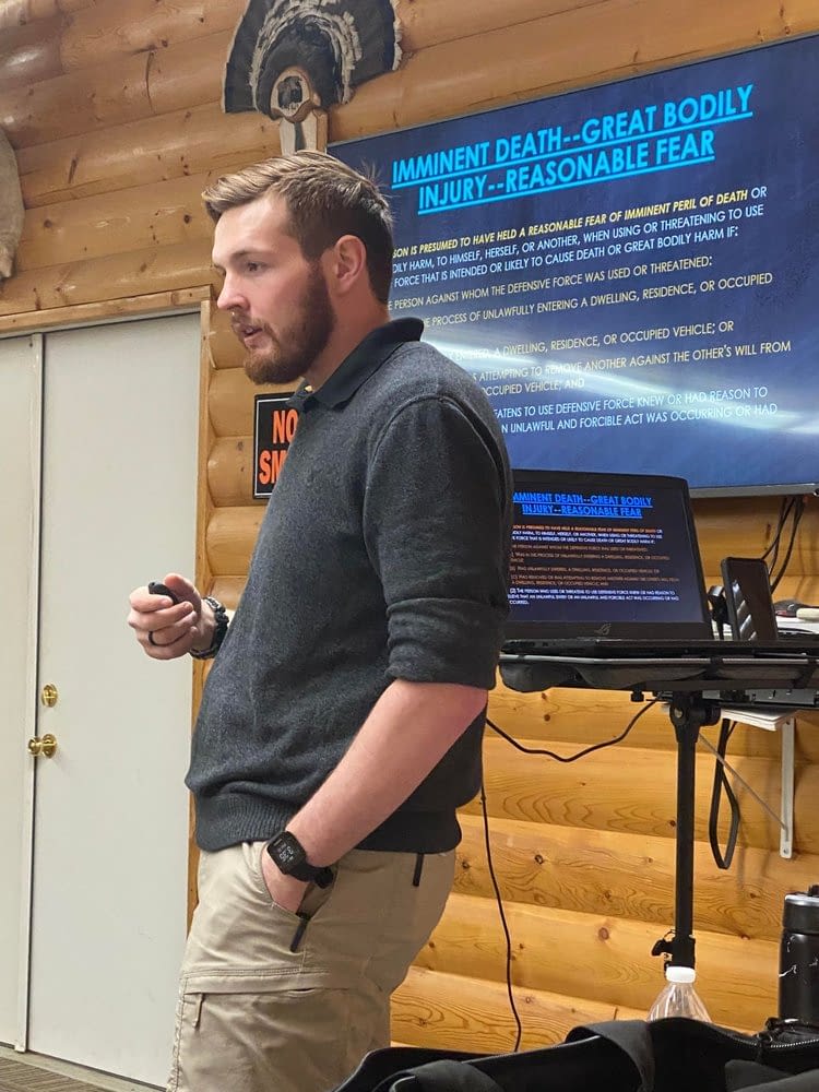 a close up photo of a man teaching the South Dakota Use Of Force Laws