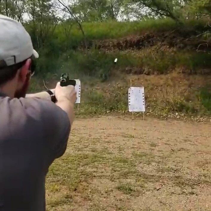 Chambered Carry: 4 Powerful Reasons You should. A Man shooting at a target wearing a light grey hat and dark grey polo
